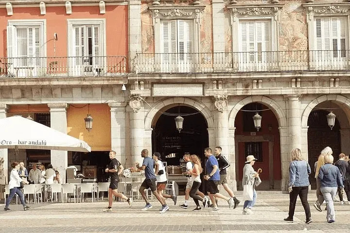 Runners in Plaza Mayor, Madrid